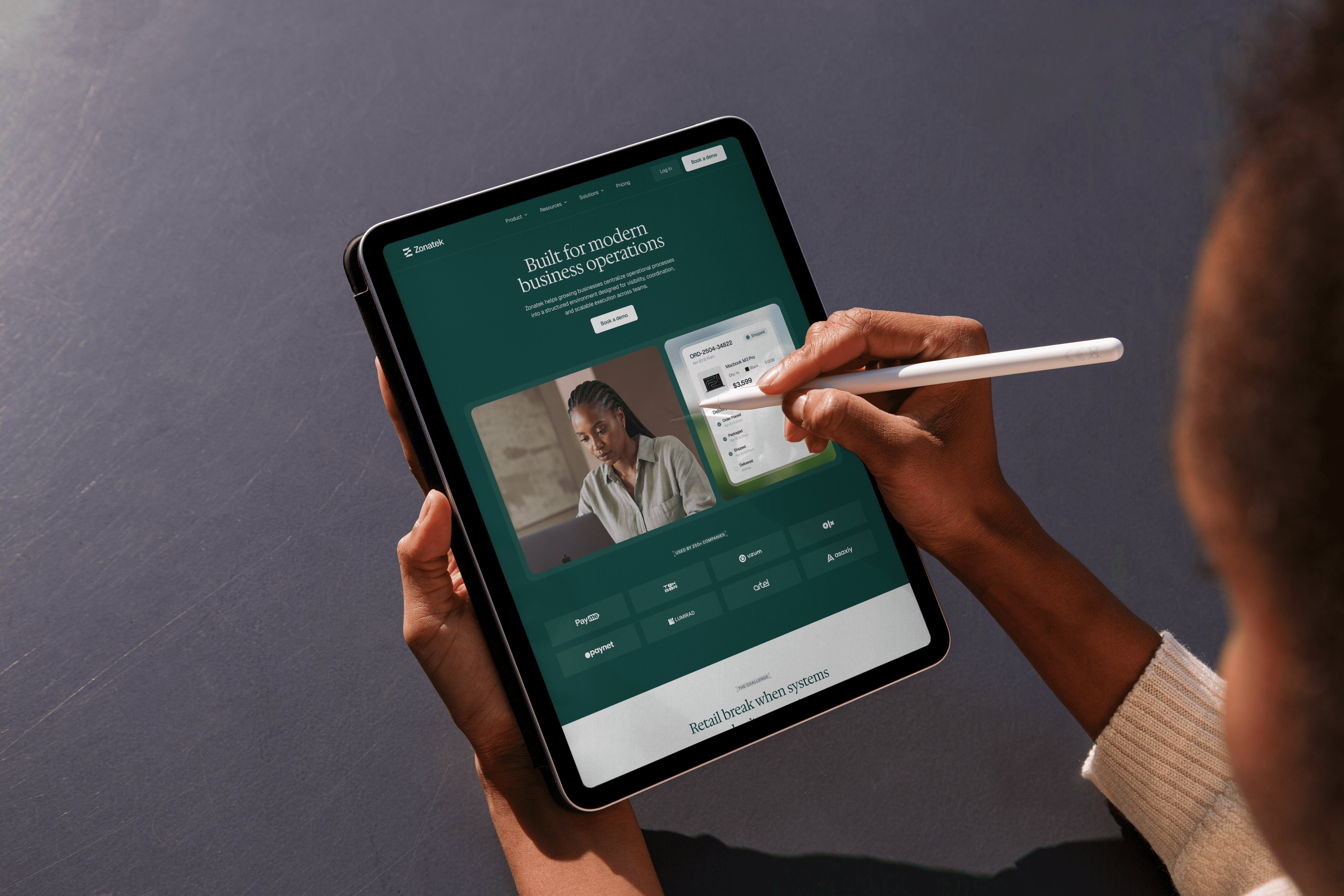 Person using a tablet with the Zonatek digital experience